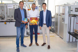 Game cards for “CATAN” and “Halli Galli” board games packed using Koehler Paper flexible packaging paper